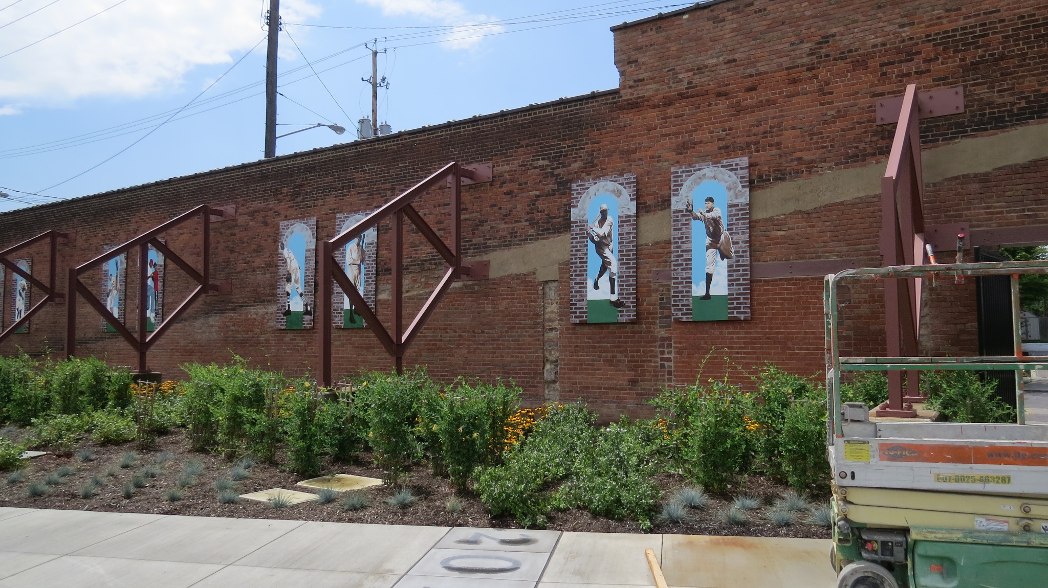 Historic baseball player murals on the League Park exterior